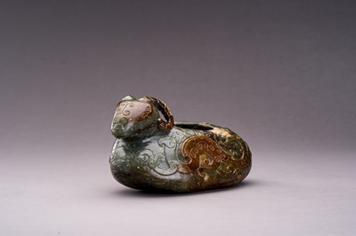 AN ARCHAISTIC SPINACH GREEN AND RUSSET JADE ‘RAM’ VESSEL