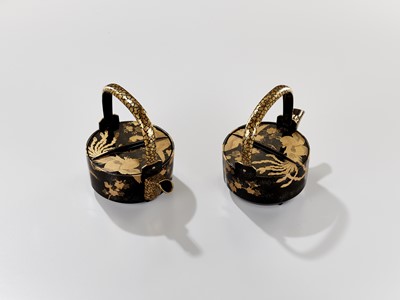 Lot 29 - A PAIR OF BLACK AND GOLD LACQUER CHOSHI (SAKE EWERS) AND COVERS