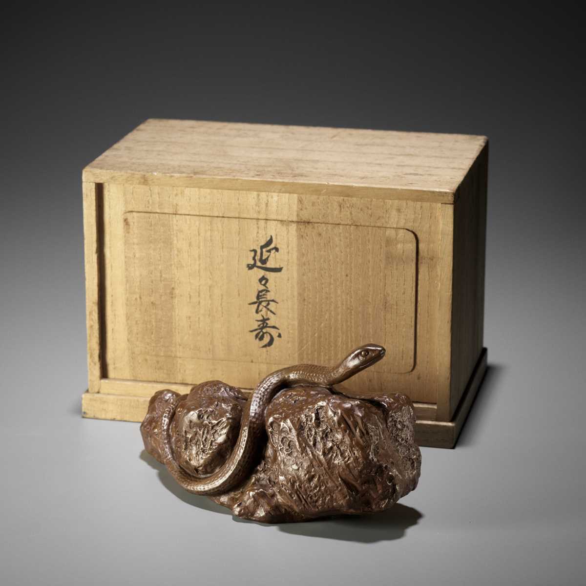 Lot 89 - TSUDA EIJU: A BRONZE OKIMONO OF A SNAKE ON A ROCK