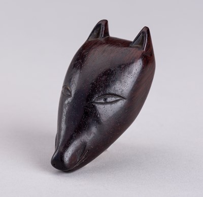 Lot 849 - AN UNUSUAL WOOD FOX MASK NETSUKE, 19TH CENTURY