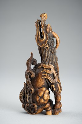 Lot 886 - KOMEI: A WOOD NETSUKE OF A KIRIN