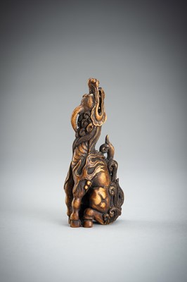 Lot 886 - KOMEI: A WOOD NETSUKE OF A KIRIN