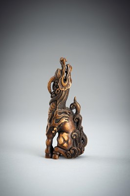 Lot 886 - KOMEI: A WOOD NETSUKE OF A KIRIN