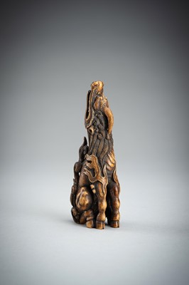 Lot 886 - KOMEI: A WOOD NETSUKE OF A KIRIN