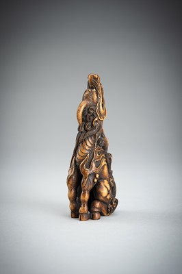 Lot 886 - KOMEI: A WOOD NETSUKE OF A KIRIN