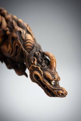 Lot 886 - KOMEI: A WOOD NETSUKE OF A KIRIN