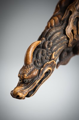 Lot 886 - KOMEI: A WOOD NETSUKE OF A KIRIN