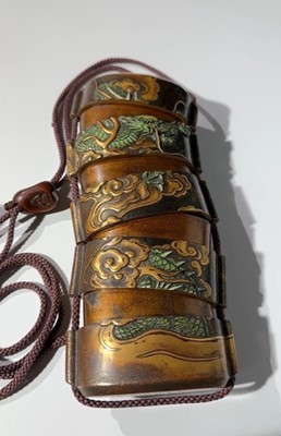 Lot 546 - KAJIKAWA KYUJIRO: AN EXCEPTIONALLY LARGE AND IMPORTANT ANTLER-INLAID LACQUER FOUR CASE INRO DEPICTING A DRAGON, DATED 1647 BY INSCRIPTION