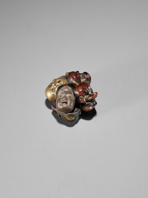 Lot 265 - A LACQUER NETSUKE OF A CLUSTER OF MASKS
