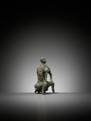 Lot 615 - A BRONZE FIGURE OF A SEATED MAN, DONG SON CULTURE