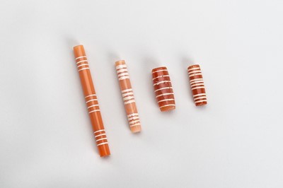 Lot 874 - A GROUP OF FOUR ETCHED PYU CARNELIAN BEADS