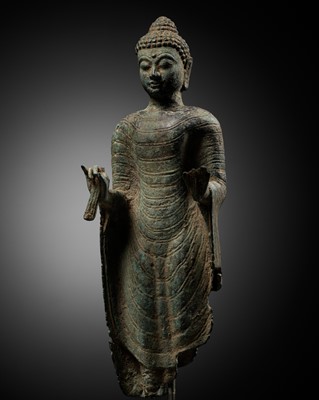Lot 310 - A FRAGMENTARY BRONZE BUST OF BUDDHA, INDONESIA, 16TH-17TH CENTURY