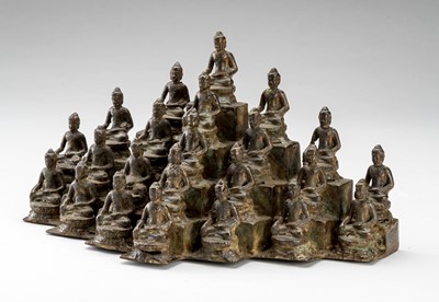 Lot 834 - A JAVANESE SCULPTURAL BRONZE GROUP DEPICTING 23 SEATED BUDDHA
