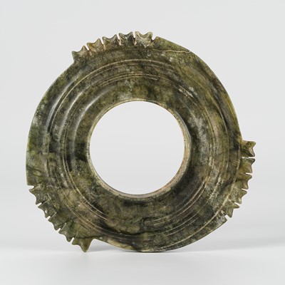 Lot 916 - A SERPENTINE COLLARED NOTCHED DISC, ZHOU STYLE