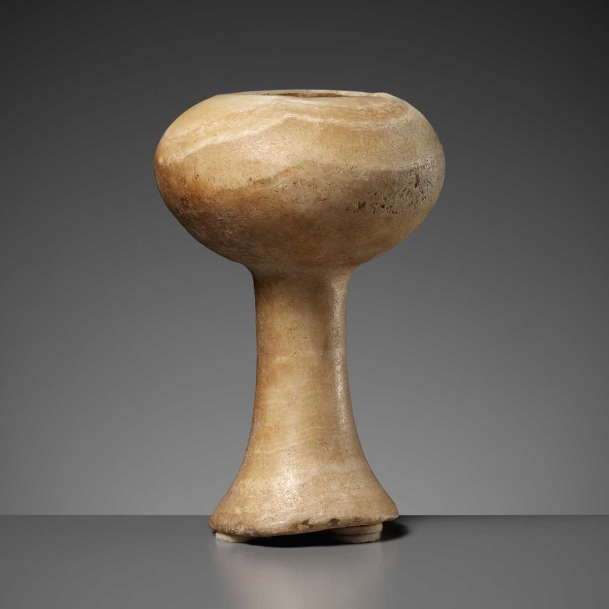 Lot 664 - A BANDED CALCITE BACTRIAN CHALICE, LATE 3RD TO EARLY 2ND MILLENIUM BC