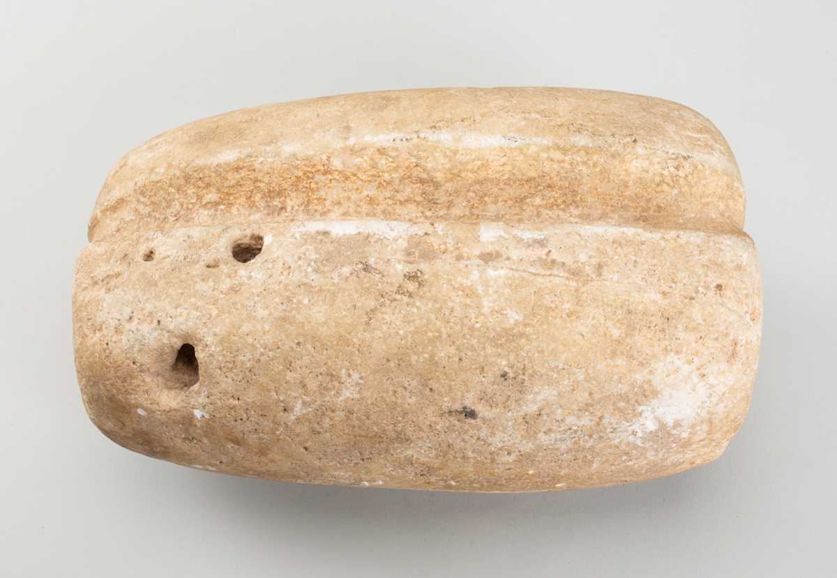 Lot 1601 A GROOVED TRAVERTINE WEIGHT, 3RD MILLENIUM
