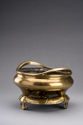 A LARGE GILT-BRONZE TRIPOD CENSER WITH MATCHING STAND, QING