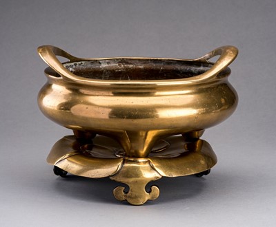 Lot 782 - A LARGE GILT-BRONZE TRIPOD CENSER WITH MATCHING STAND, QING