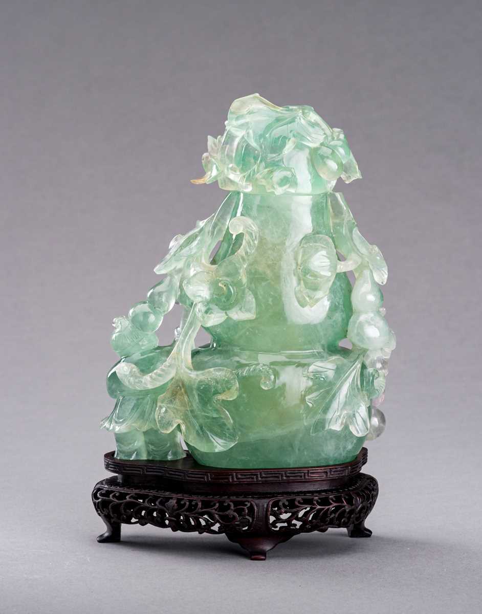 Lot 85 - A GREEN FLUORITE ‘DOUBLE GOURD AND BOY’ VASE