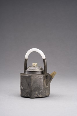 Lot 781 - A YIXING PEWTER-ENCASED AND JADE-INSET TEAPOT AND TWO CUPS, 1900s