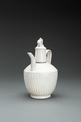 Lot 588 - A DING-TYPE WHITE GLAZED CERAMIC EWER, QING