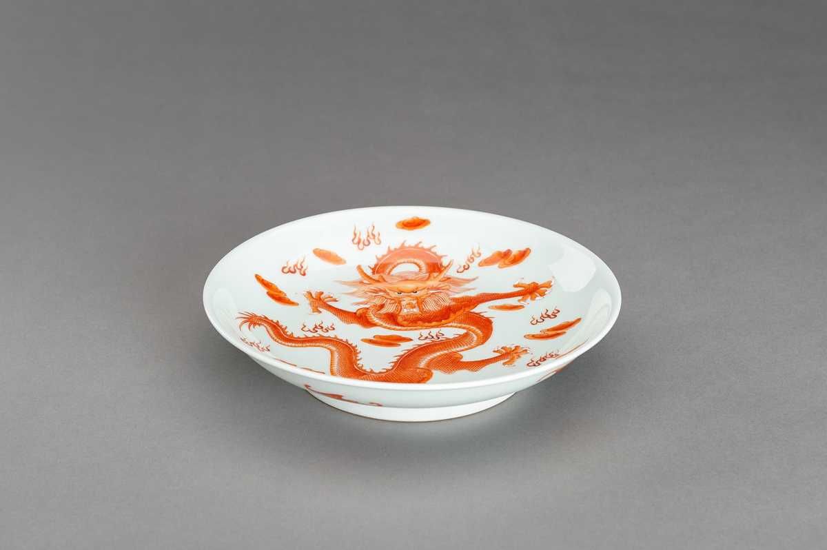 Lot 745 AN IRONRED ‘DRAGON AND BATS’ PORCELAIN DISH