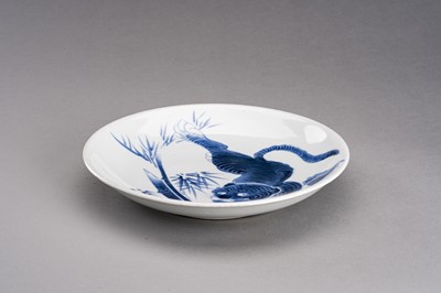 Lot 1210 - A BLUE AND WHITE ARITA IMARI PORCELAIN DISH ‘TIGER AND BAMBOO’, MEIJI