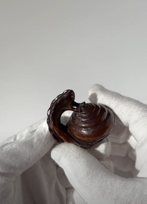 Lot 353 - SHUZAN: AN EXCEPTIONAL WOOD NETSUKE OF A SNAIL ACROBAT