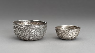 Lot 863 - A LOT WITH TWO EMBOSSED SILVER BOWLS WITH FLORAL DESIGN