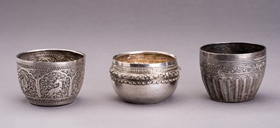 Lot 860 - A LOT WITH THREE EMBOSSED SILVER BOWLS