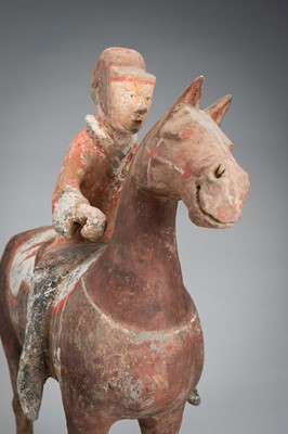 Lot 520 - A POTTERY FIGURE OF AN EQUESTRIAN, HAN DYNASTY