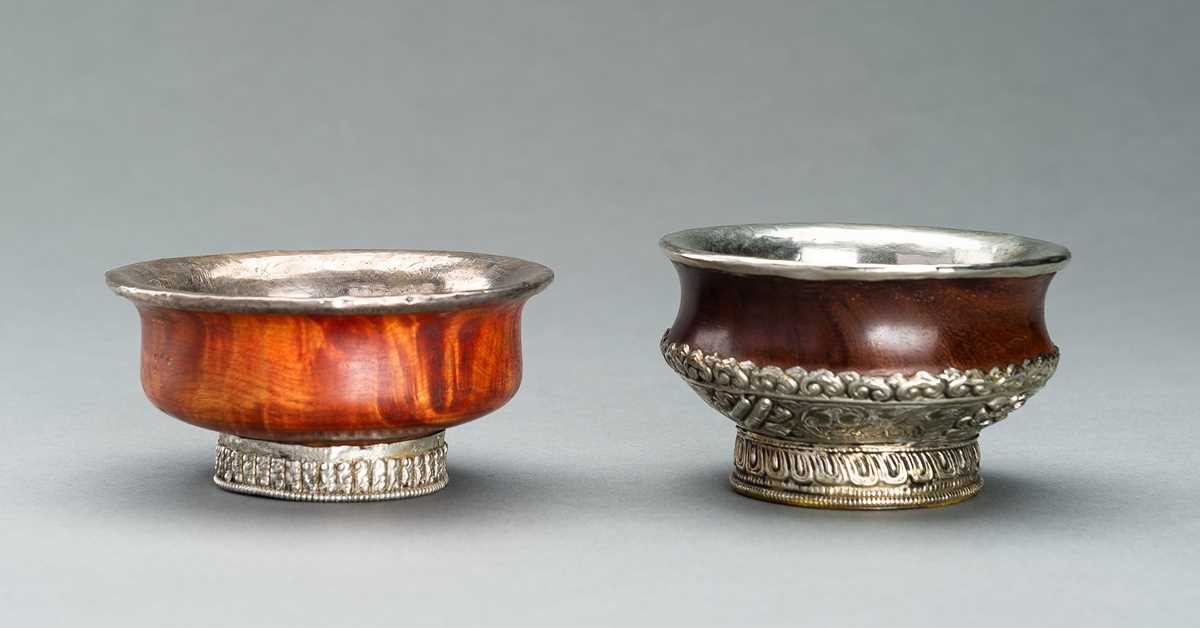 Lot 355 - TWO SILVER MOUNTED WOOD BUTTER CUPS, c. 1920s