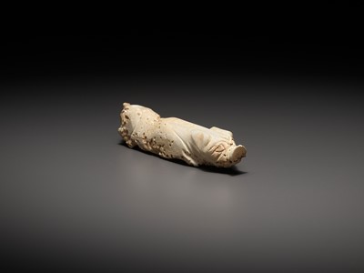 Lot 1047 - A WHITE JADE FIGURE OF A PIG, HAN DYNASTY