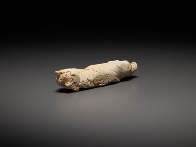 Lot 75 - A WHITE JADE FIGURE OF A PIG, HAN DYNASTY