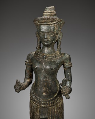 Lot 281 - A RARE BRONZE FIGURE OF UMA, ANGKOR WAT STYLE, KHMER EMPIRE, 12TH CENTURY