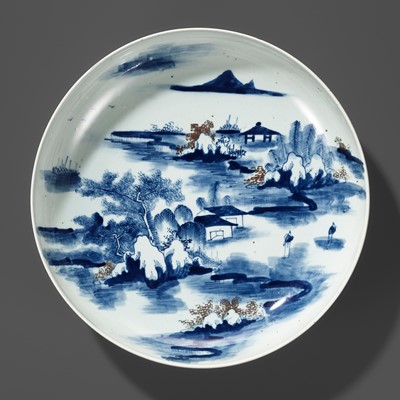 Lot 393 - A LARGE UNDERGLAZE-BLUE AND COPPER-RED GLAZED CHARGER, KANGXI PERIOD