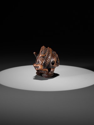 Lot 325 - A WOOD NETSUKE OF A COILED DRAGON WITH TAMA