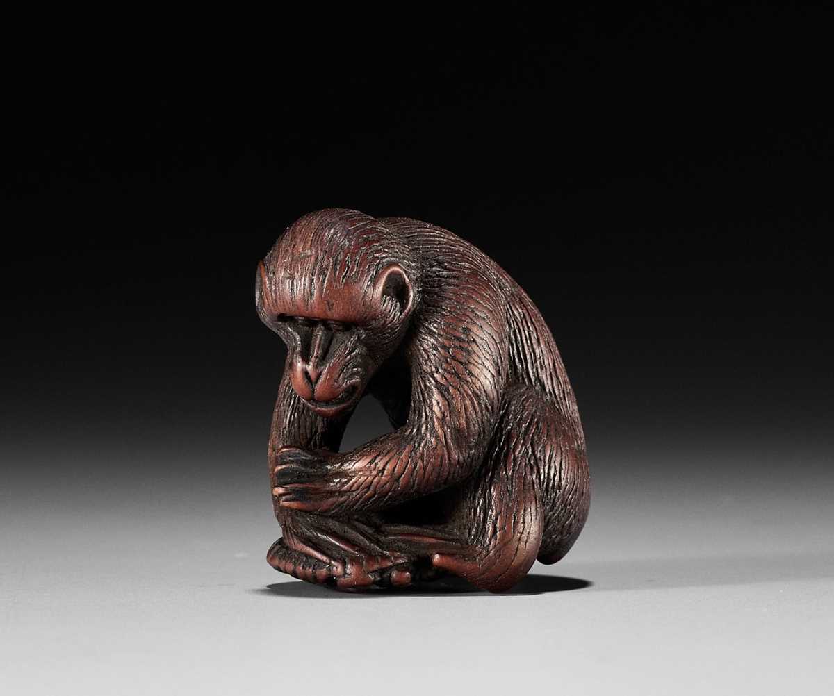 Lot 862 - A WOOD NETSUKE OF A MONKEY WITH A TORTOISE,