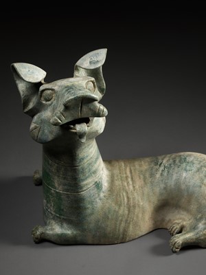 Lot 65 - A LARGE GREEN-GLAZED RED POTTERY FIGURE OF A DOG, HAN DYNASTY