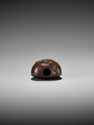 Lot 368 - AN EARLY AUTUMNAL WOOD NETSUKE OF A CHESTNUT WITH CHRYSANTHEMUM