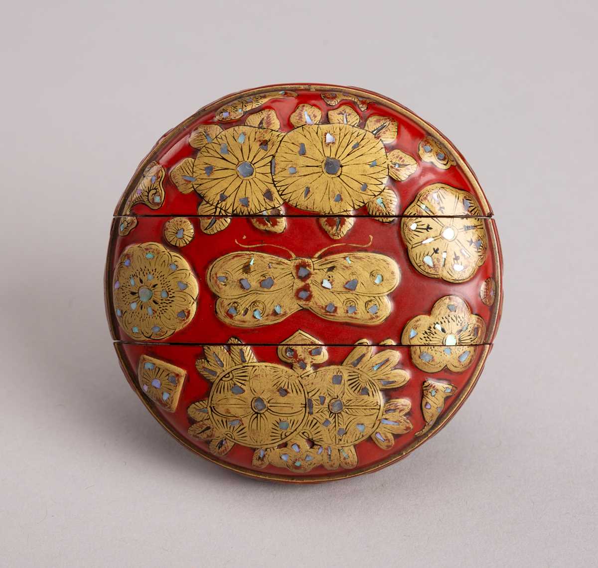 Lot 579 - A ROUND RED AND GILT LACQUER TWO-CASE INRO,