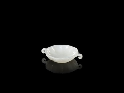 Lot 44 - A WHITE JADE MUGHAL-STYLE LOBED BOWL, 18TH CENTURY