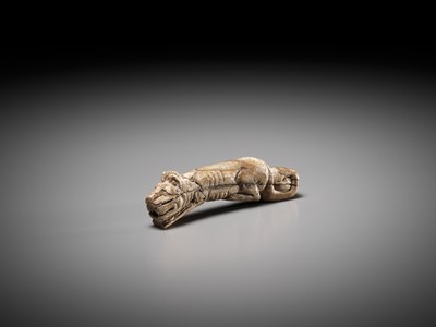 Lot 45 - A RARE CARVED BONE FIGURE OF A TIGER, SHANG DYNASTY