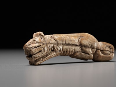 Lot 1013 - A RARE CARVED BONE FIGURE OF A TIGER, SHANG DYNASTY