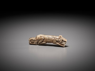 Lot 45 - A RARE CARVED BONE FIGURE OF A TIGER, SHANG DYNASTY