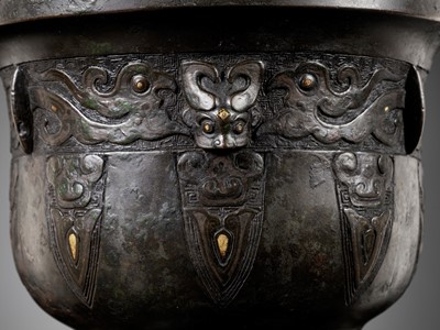 Lot 315 - A GOLD AND SILVER-INLAID BRONZE ARCHAISTIC STEAMER, SONG TO MING DYNASTY