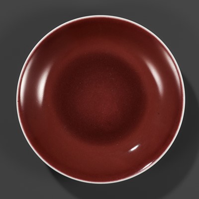 Lot 217 - A COPPER-RED GLAZED DISH, WITH A LIVER-RED GLAZE POOLING IN THE WELL, QIANLONG MARK AND PERIOD