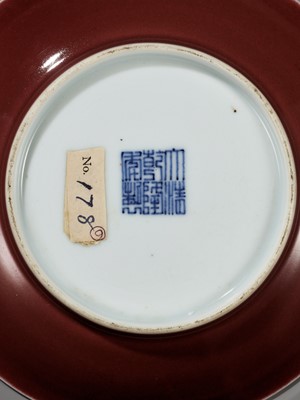 Lot 217 - A COPPER-RED GLAZED DISH, WITH A LIVER-RED GLAZE POOLING IN THE WELL, QIANLONG MARK AND PERIOD