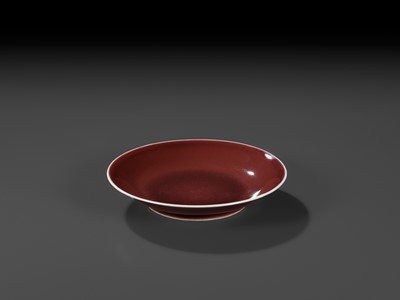 Lot 217 - A COPPER-RED GLAZED DISH, WITH A LIVER-RED GLAZE POOLING IN THE WELL, QIANLONG MARK AND PERIOD