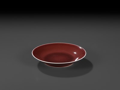 Lot 217 - A COPPER-RED GLAZED DISH, WITH A LIVER-RED GLAZE POOLING IN THE WELL, QIANLONG MARK AND PERIOD